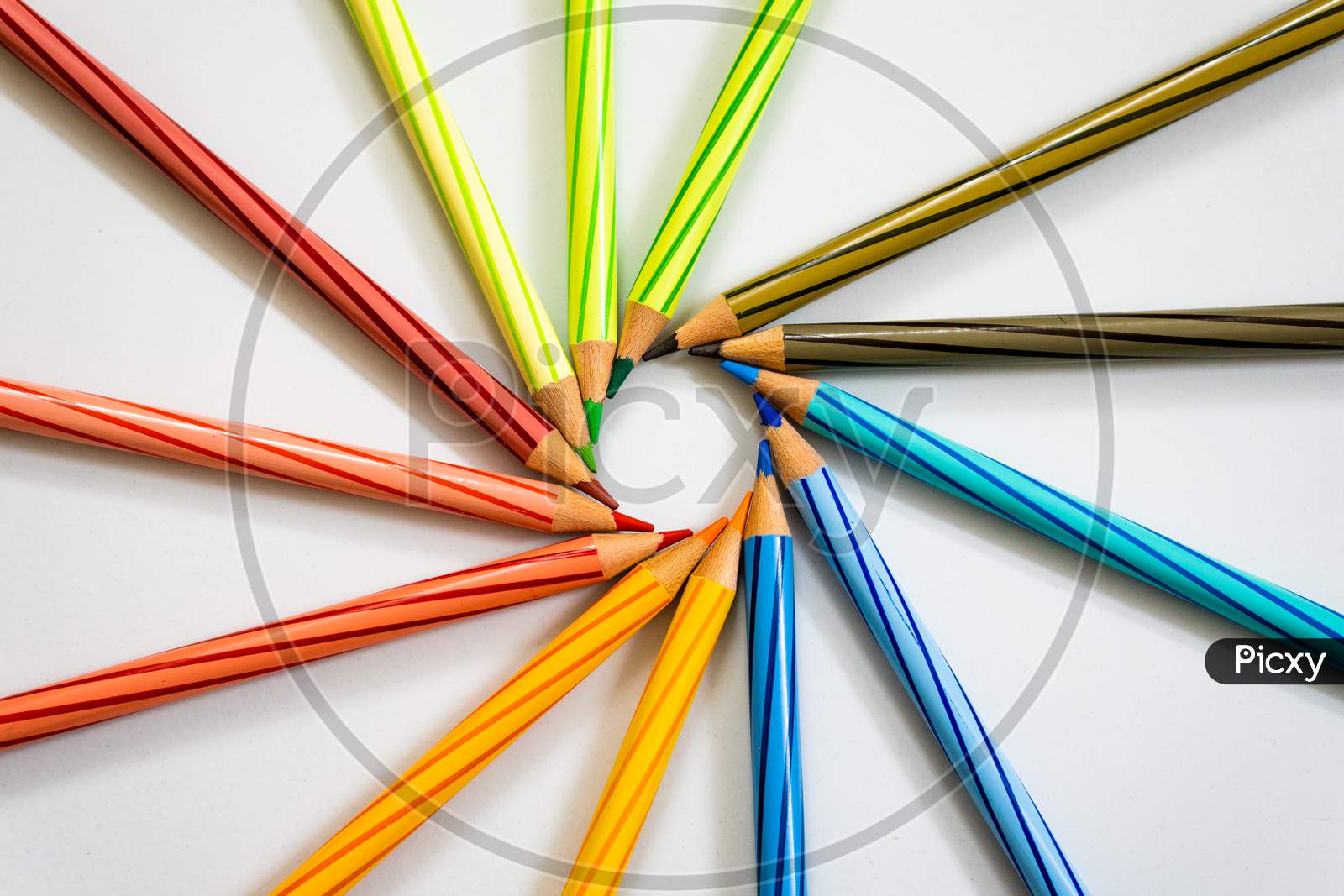 Color Pencils arranged in a circle On white Background