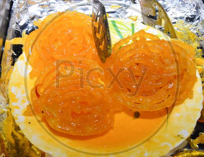 Indian delicious sweet jalebi placed on a plate