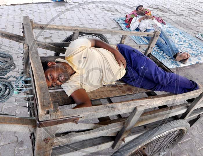 Labour Sleeps At A Railway Station During A Nationwide Lockdown Imposed In The Wake Of Coronavirus or COVID-19  Pandemic, In Guwahati Thursday, 16 April, 2020.