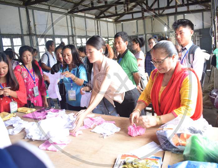 Chinese delegates Exhibiting Clothes at an Expo