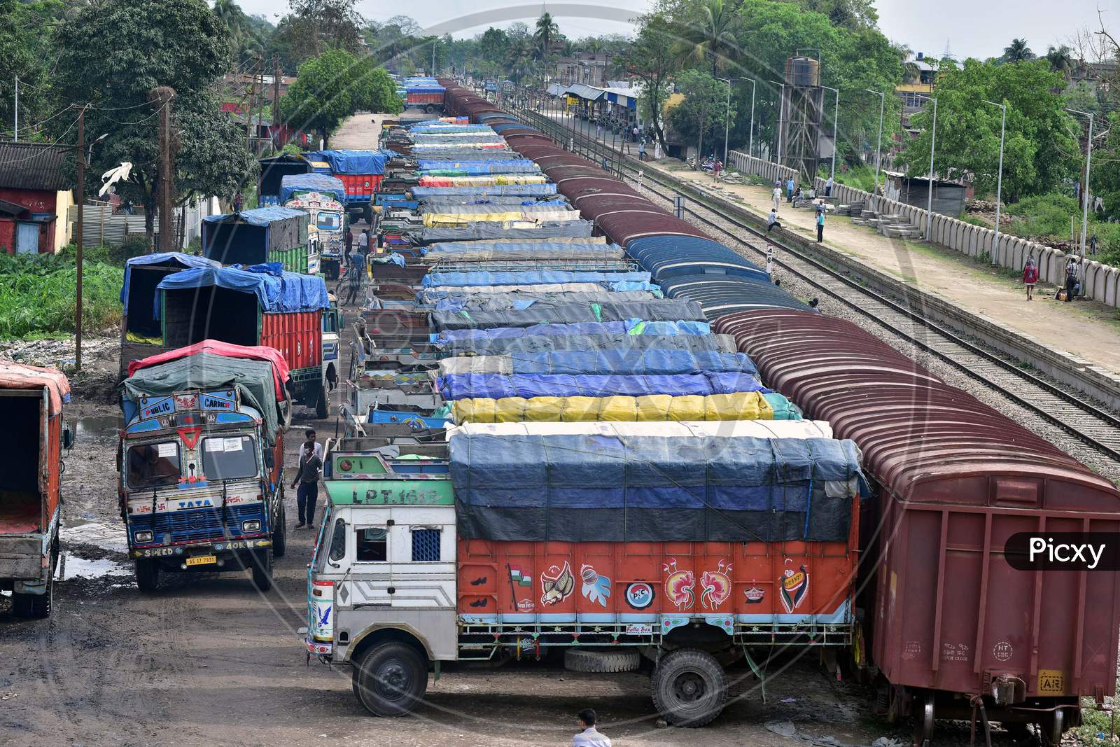 Trucks Lined Up To Upload Essential Commodities That Are Supplied From Other States In Goods Train Amid The Nation Wide Lockdown In The Wake Of Covid19 Outbreak At Haibargaon Railway Station In Nagaon District Of Assam On April 17,2020.