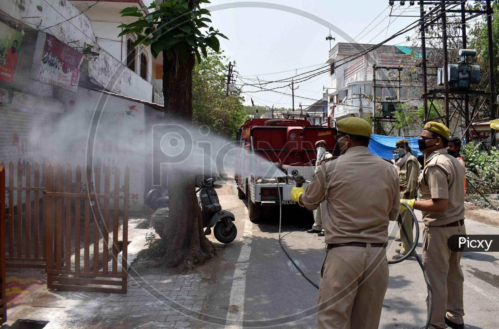 Fire man Sprinkling Disinfectant Water On the Streets For Corona Virus (COVID-19)  Spread Eradication in Prayagraj