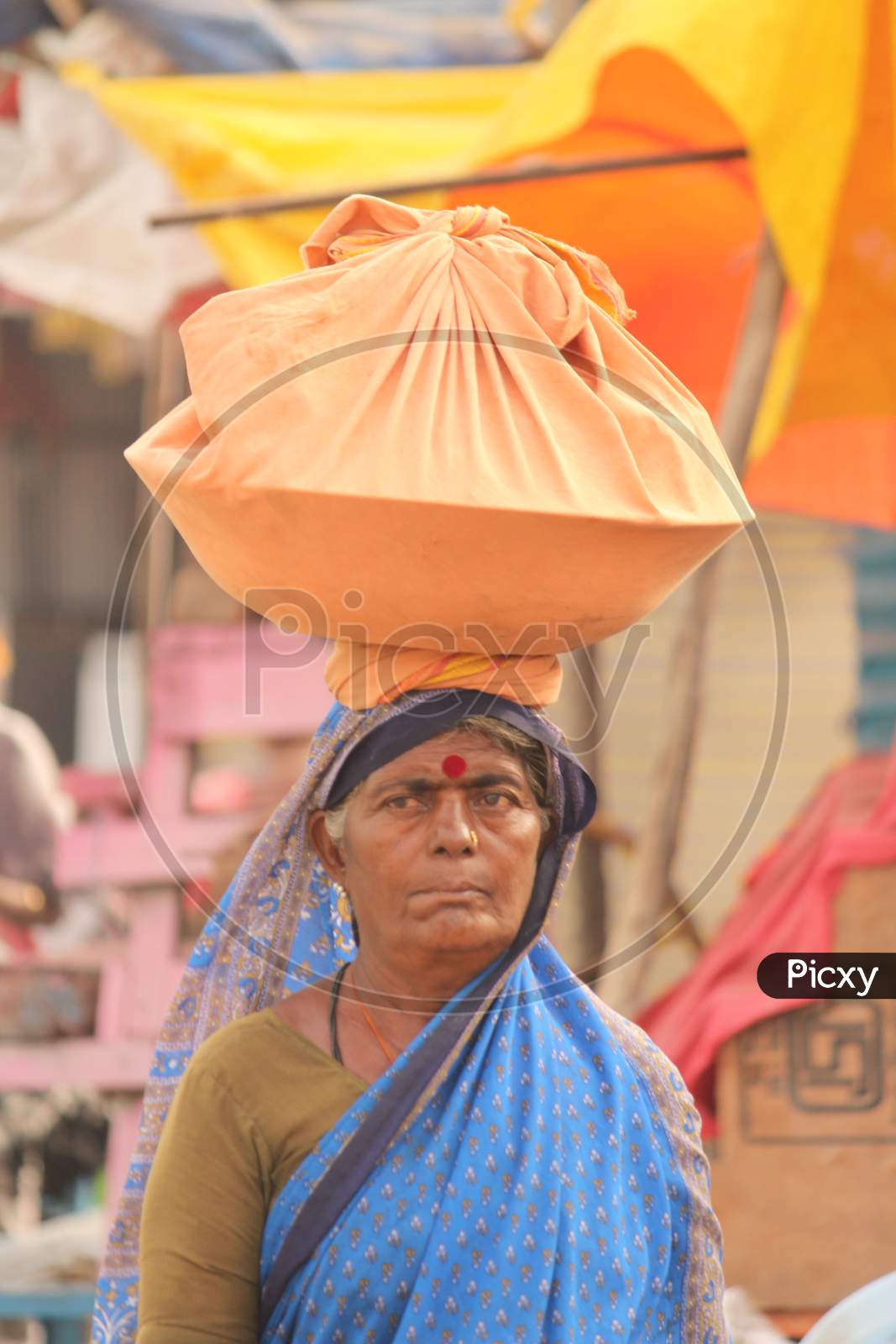 A woman carrying weight on her head