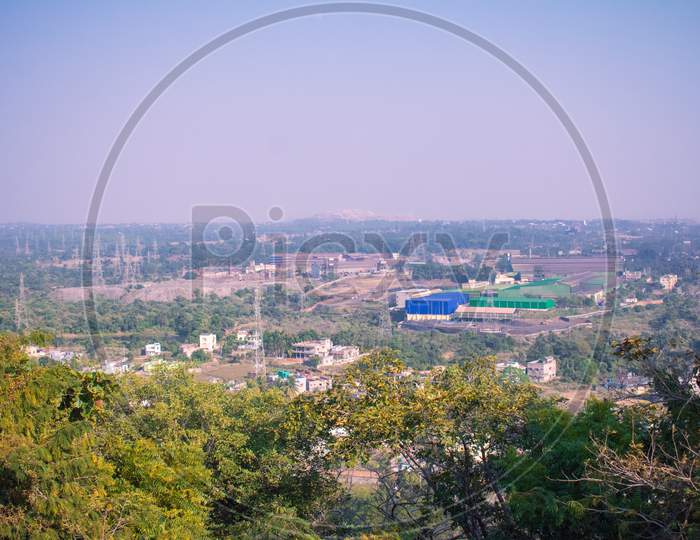 Long Distant View Of A Residential Area Captured From The Top Of A Hill