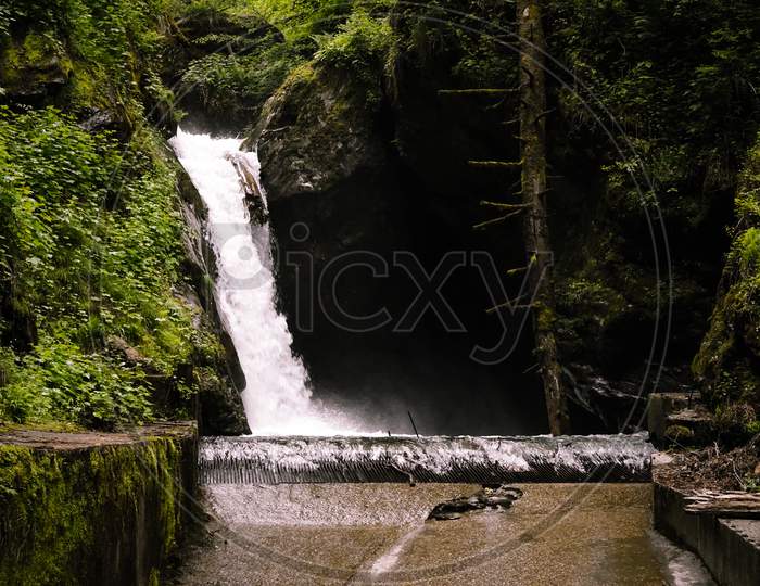 Huge White Waterfall View In Middle Of Dense Forest. This Waterfall Located In Pulga, Himachal, India.