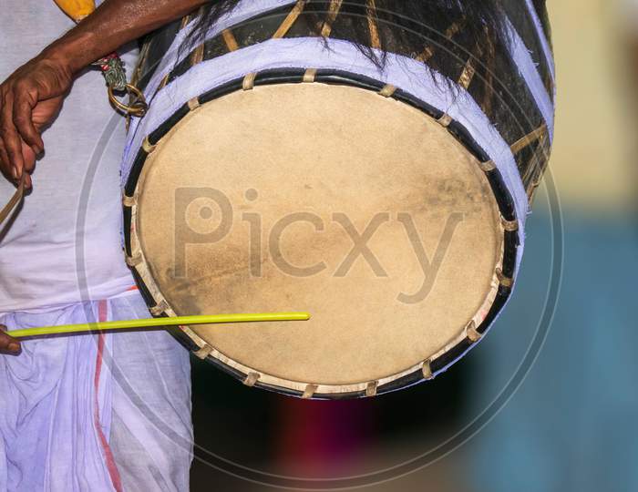 A drummer called dhaki in bengal or west bengal plays a special drum called dhak