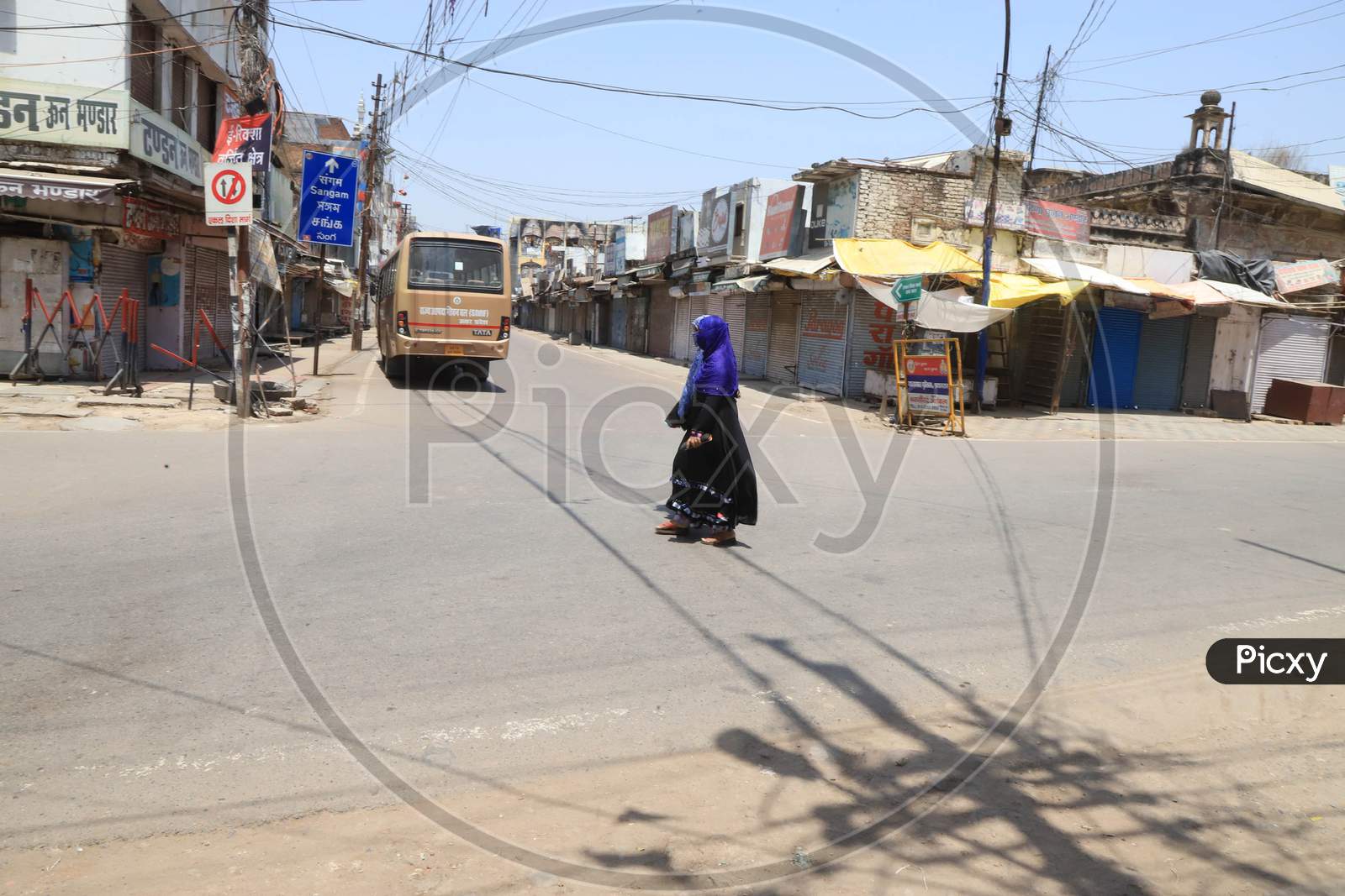 Muslim Women Walk On The Empty Road During A Nationwide Lockdown To Slow The Spreading Of The Coronavirus Disease (Covid-19), In Prayagraj, April, 18, 2020.