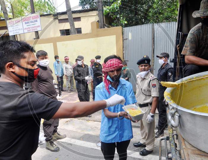 Assam Police Personnel Distribute Food Among The Needy  During The Nationwide Lock down In The Wake Of Corona virus Pandemic, In Guwahati On April 18,2020
