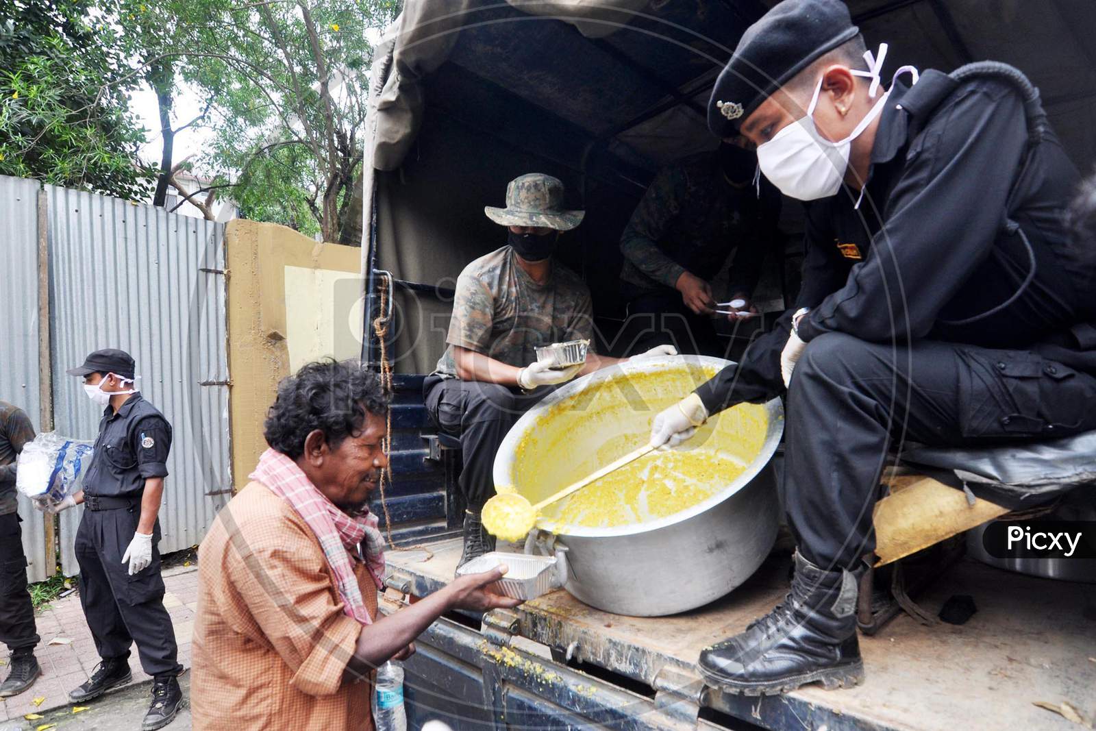 Assam Police Personnel Distribute Food Among The Needy  During The Nationwide Lock down In The Wake Of Corona virus Pandemic, In Guwahati On April 18,2020