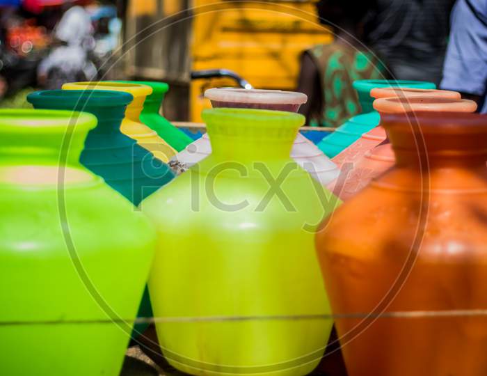 Multicolor Plastic Water Canister Filled Metro Water And Which Its Transport In Tricycle Auto Richshaw And Water Back To Their Homes Where It Is Used For Drinking, Hygiene And Other Necessary Uses.