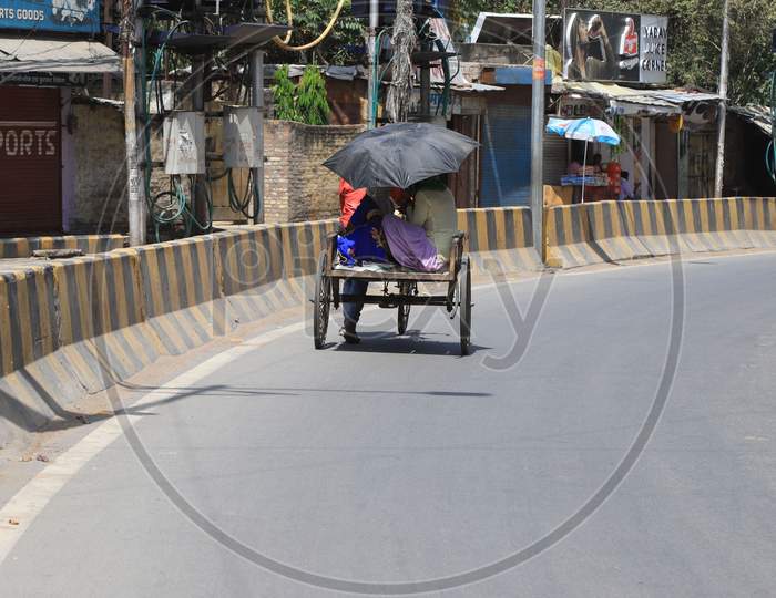 Women Ride on  Trolly On Road During A Nationwide Lockdown To Slow The Spreading Of The Coronavirus Disease (Covid-19), In Prayagraj, April, 18, 2020.