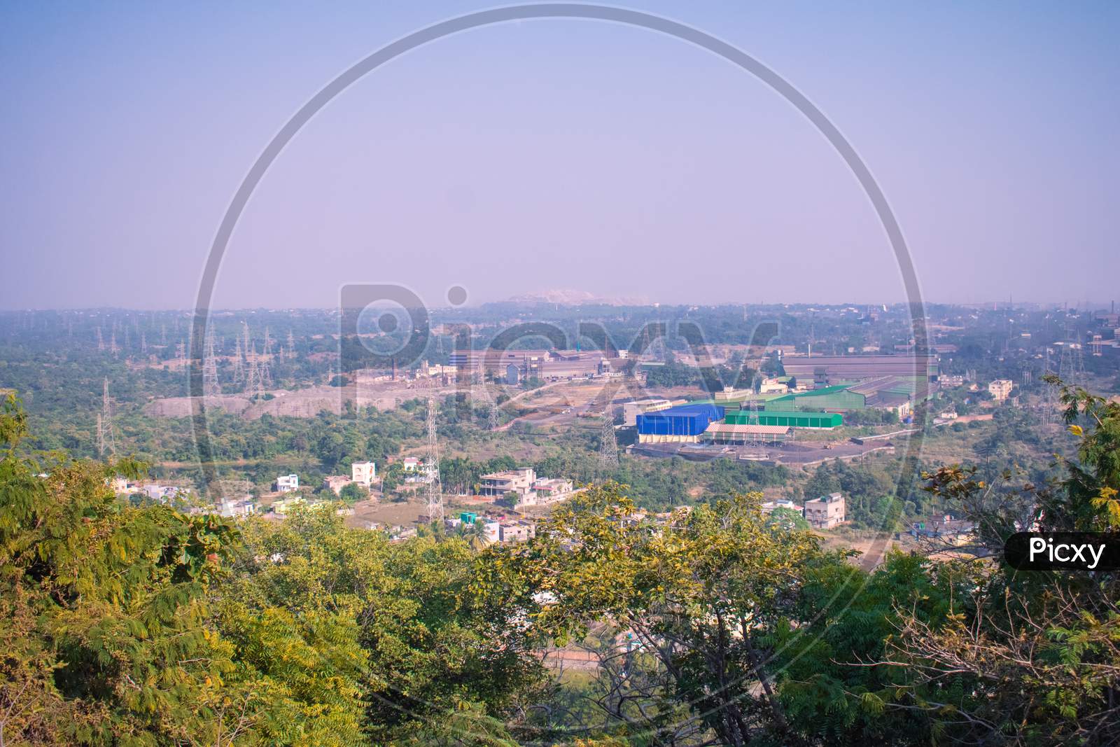 Long Distant View Of A Residential Area Captured From The Top Of A Hill
