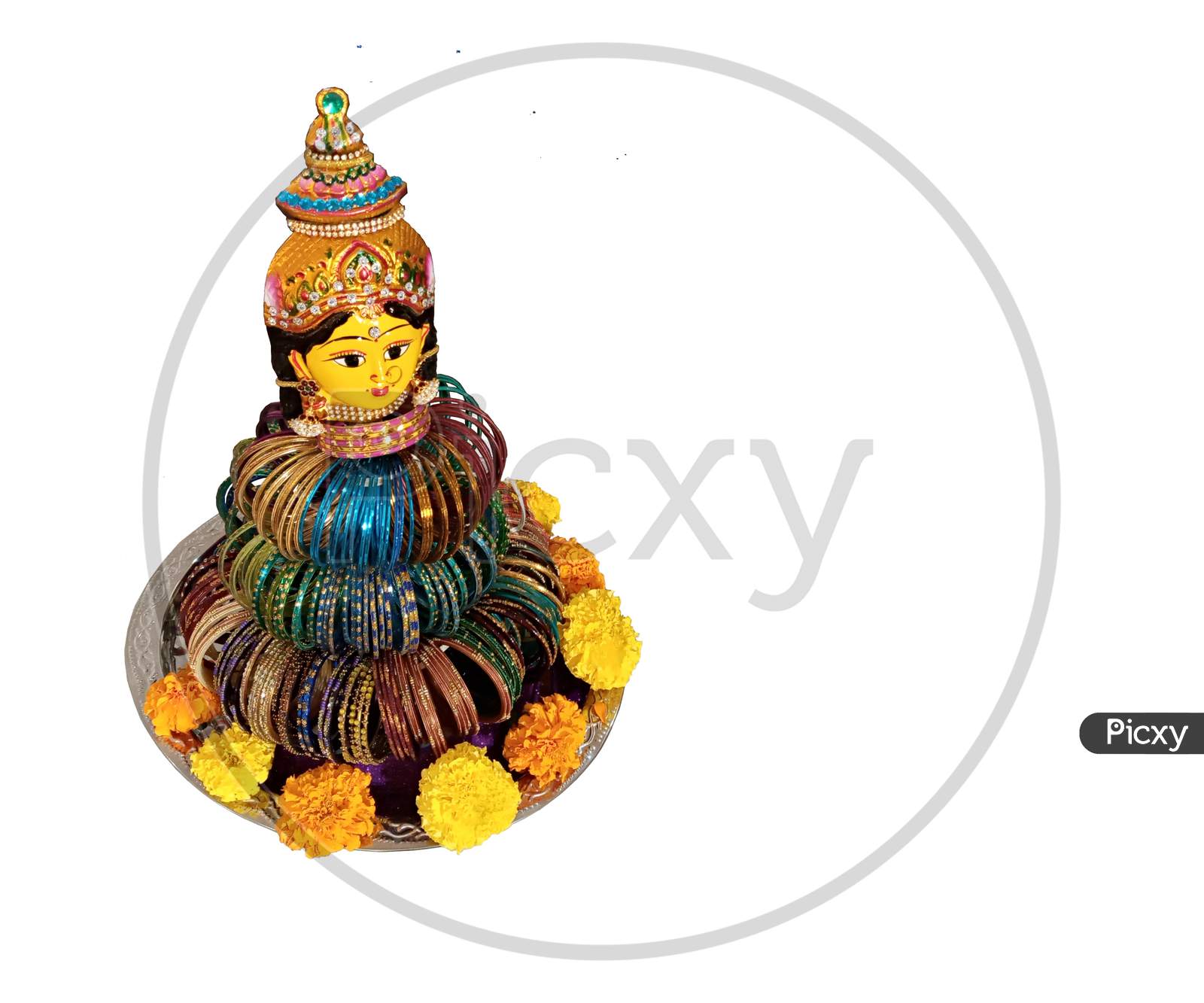 Isolated symbolic doll for bangle rituals in Indian weddings