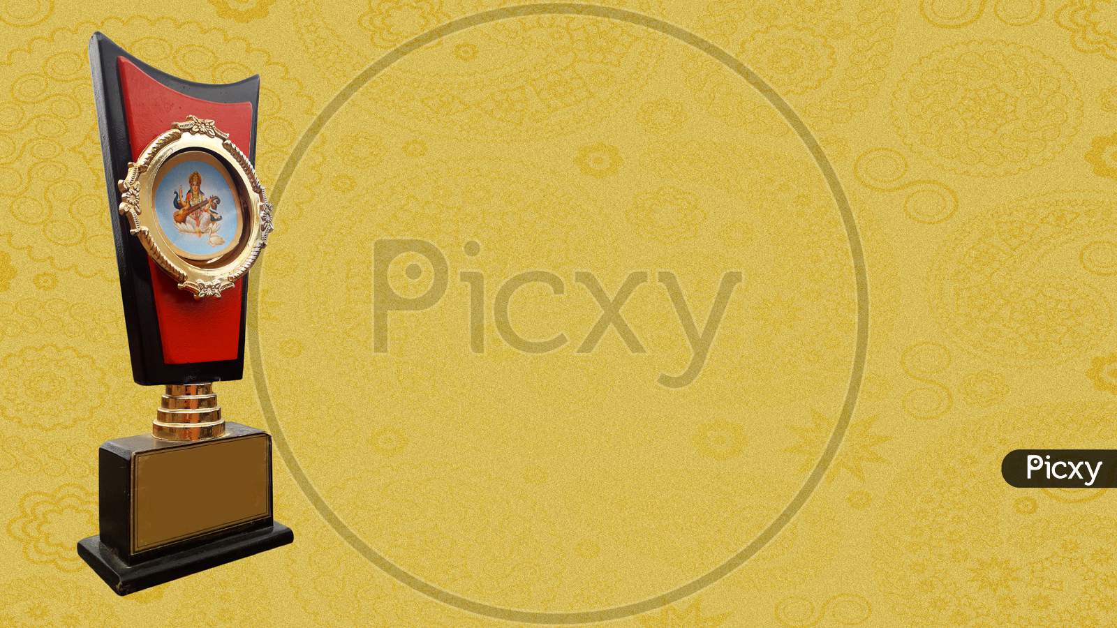 An orange colored trophy  isolated in golden textured background with attractive design