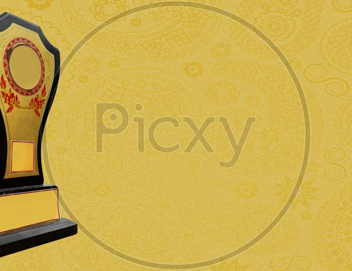 A golden trophy isolated  in golden textured background