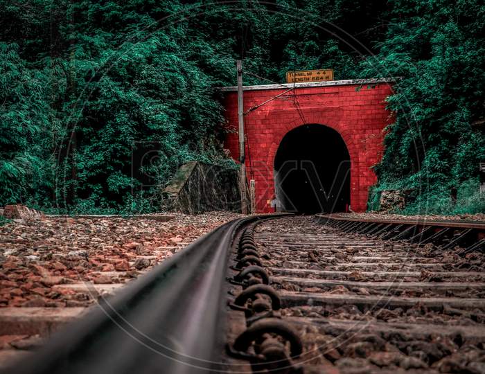 railway track passing through a tunnel