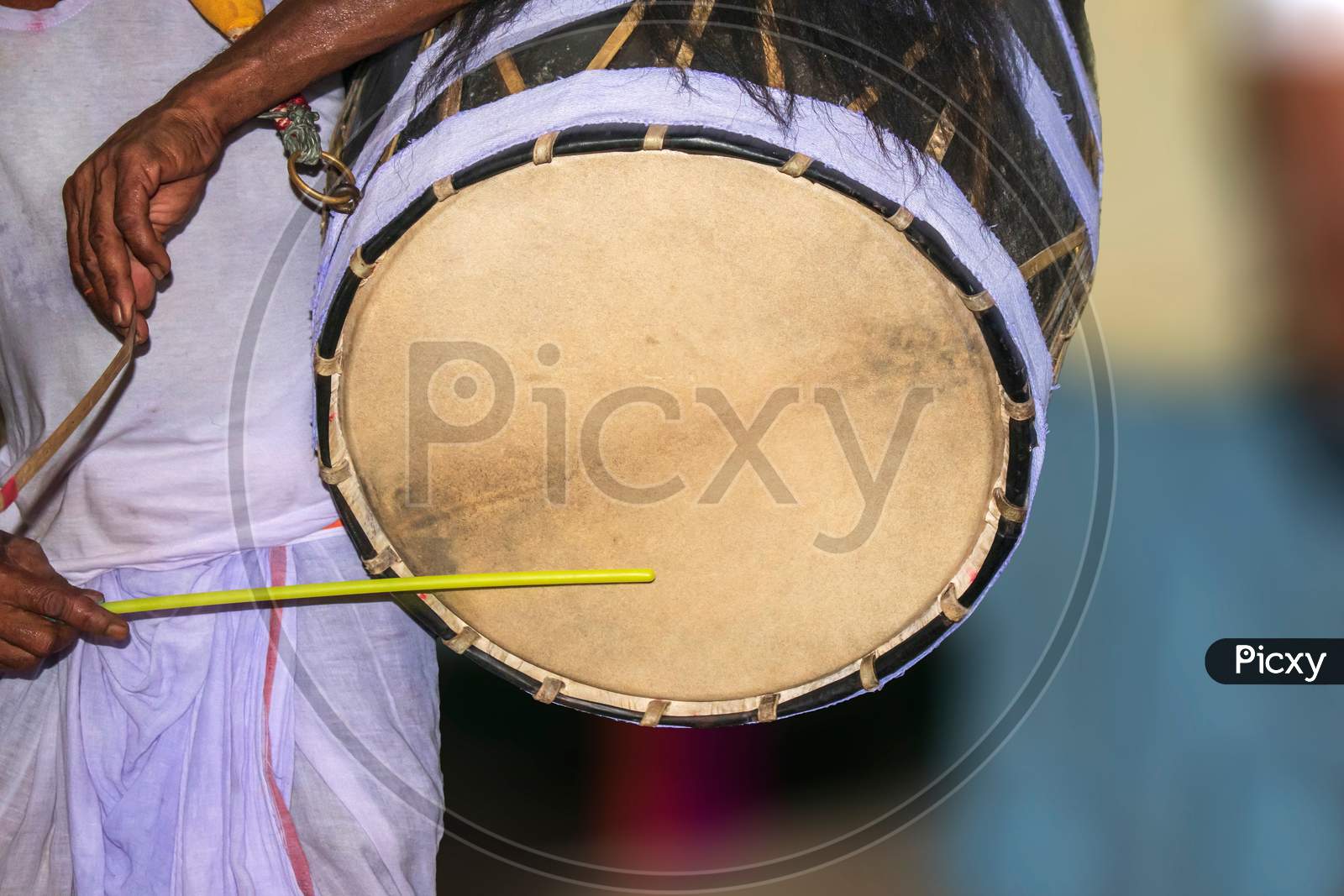 A drummer called dhaki in bengal or west bengal plays a special drum called dhak