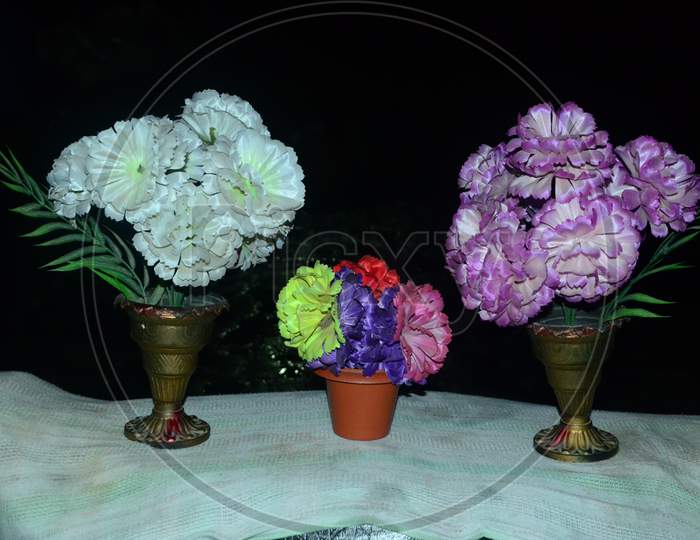 Flower Vase With Artificial Flowers On a Table