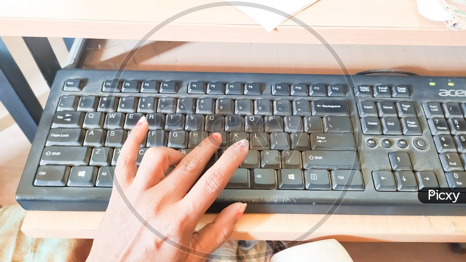 pressing keys of a keyboard.