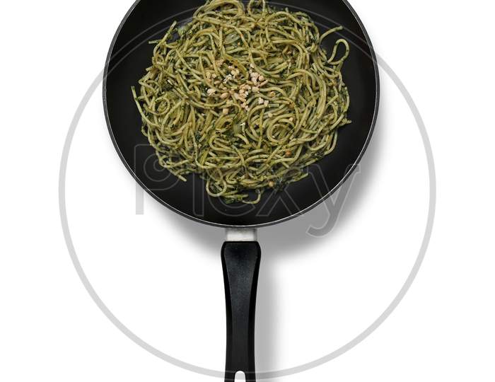 pan with spaghetti and pesto , beautiful food , high quality