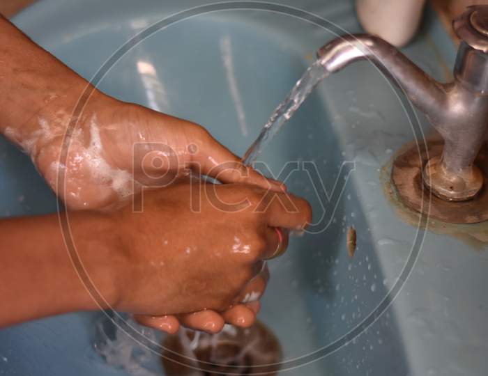 washing hands with hand wash Liquid for Prevention From Corona Virus  ( COVID-19)