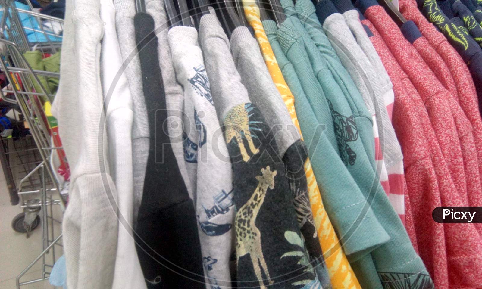 Clothes With Fabric texture In a Closet Of a Store Closeup