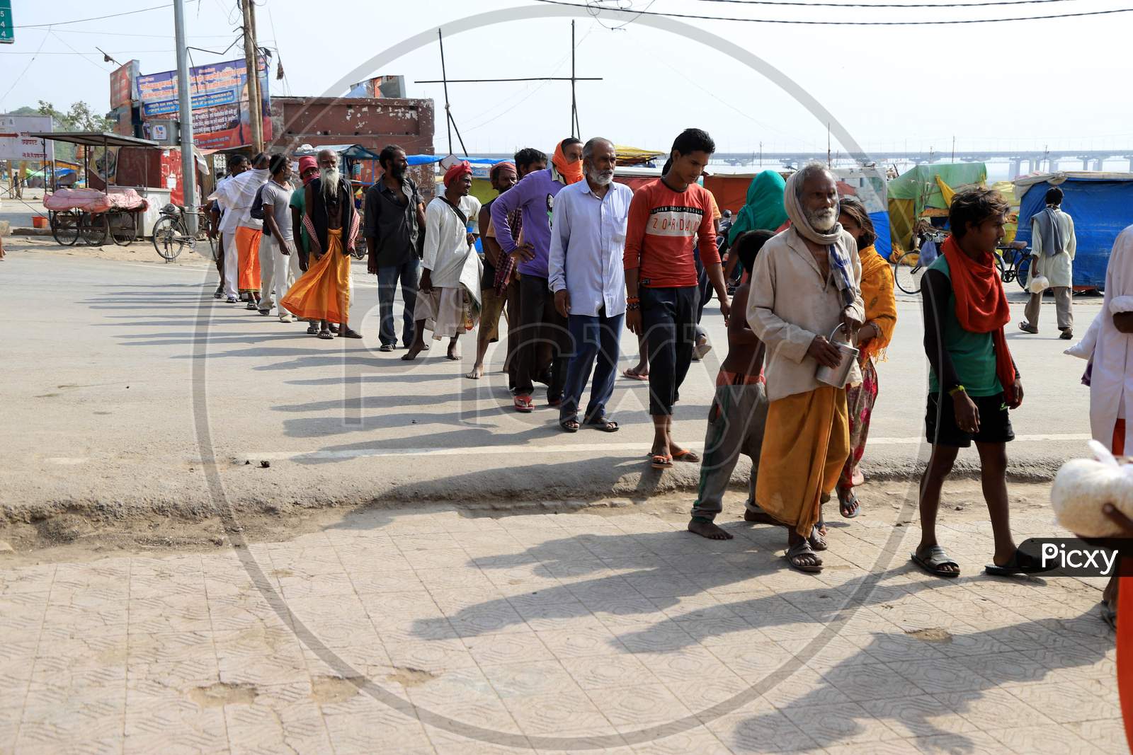 Homeless People Queue To Takes Free Food During A Nationwide Lock down To Slow The Spreading Of The Corona virus Disease (Covid-19), In Prayagraj, April, 19, 2020