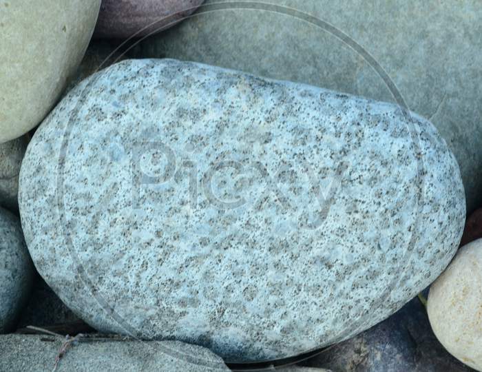 Pebble Stones In a River Bed