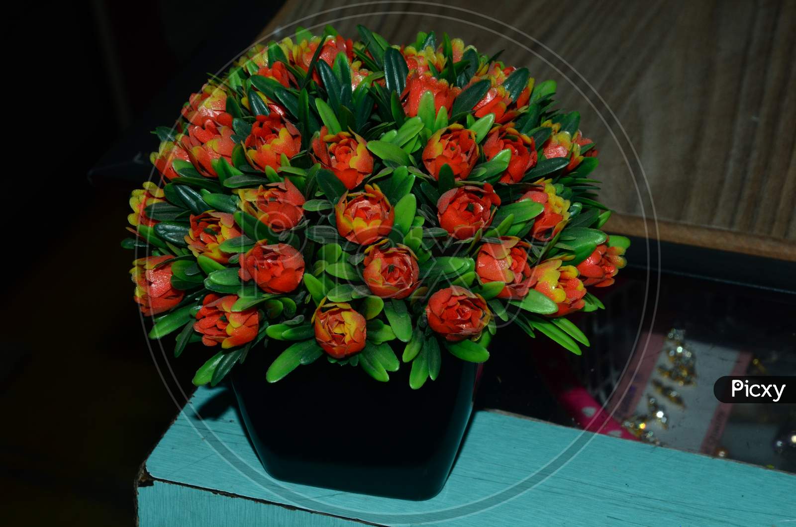 Flower Vase With Artificial Flowers On a Table