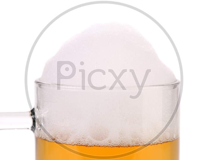 Closeup Of Beer Glass With Foam. Isolated On A White Background.