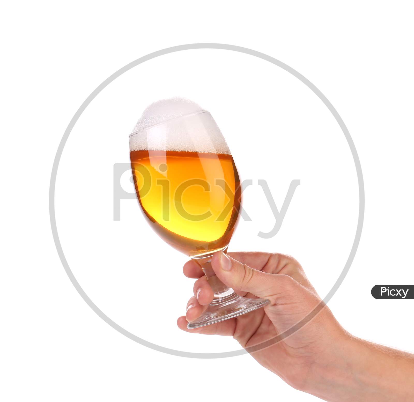Glass Of Beer With Foam In Hand. Isolated On A White Background.