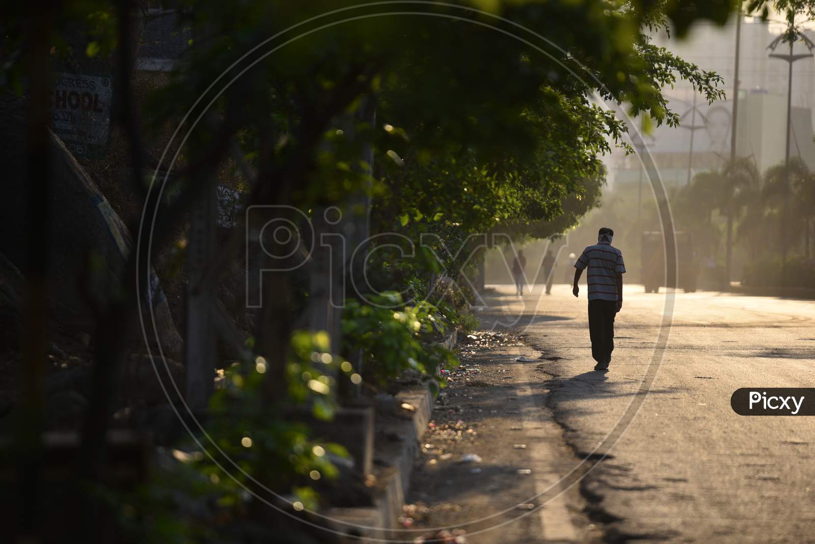 a man walking early morning violating the lockdown rules amid coronavirus pandemic, covid19