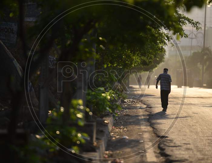 a man walking early morning violating the lockdown rules amid coronavirus pandemic, covid19