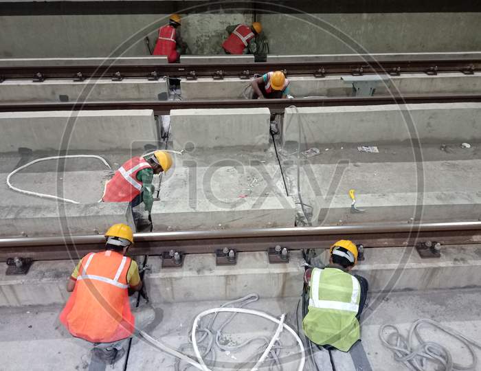 Construction Workers Working at Under Construction Metro Tracks And Metro Stations In Hyderabad