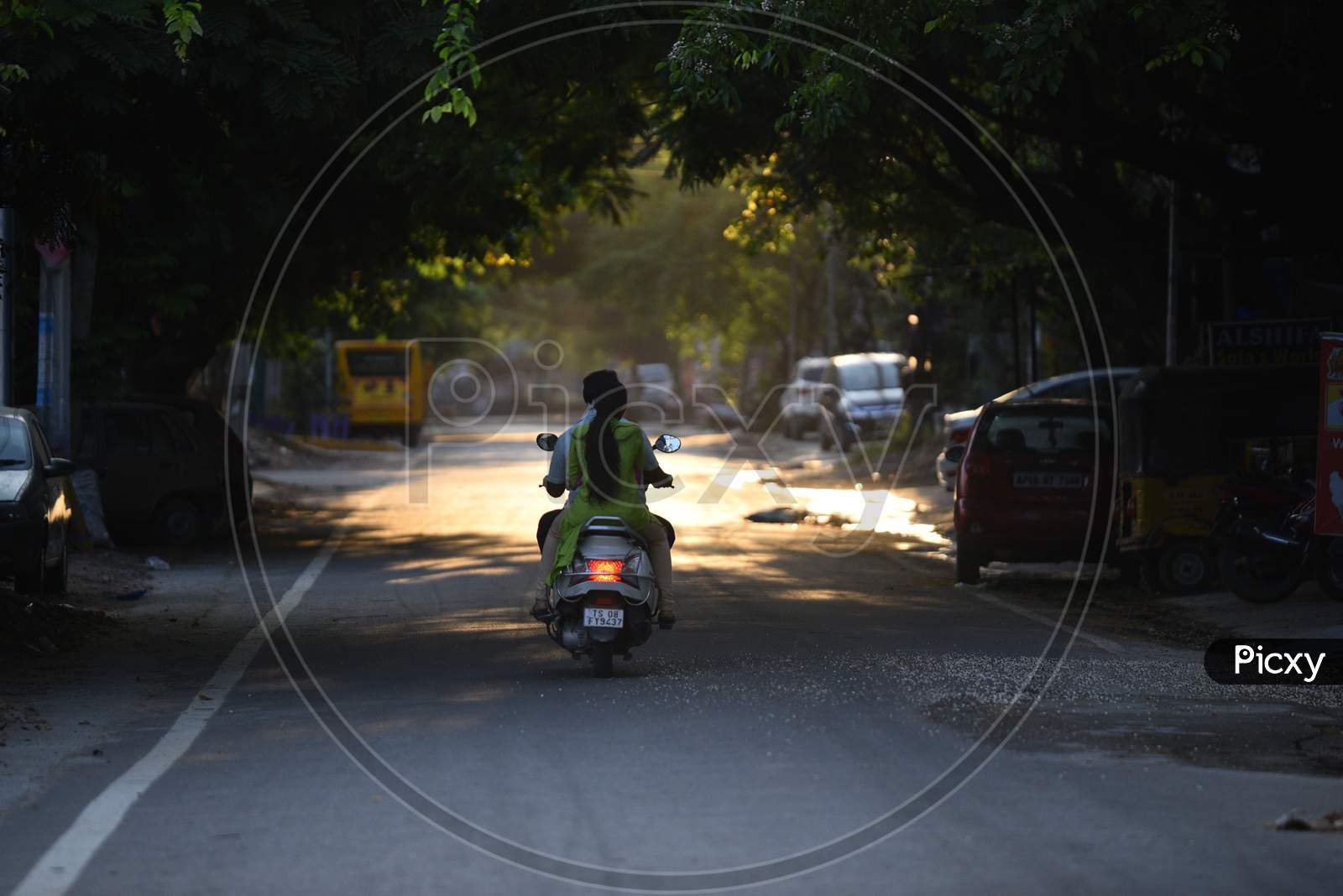 a two wheeler vehicle moving on an empty road during nstionwide lockdown amid coronavirus pandemic, April 2020