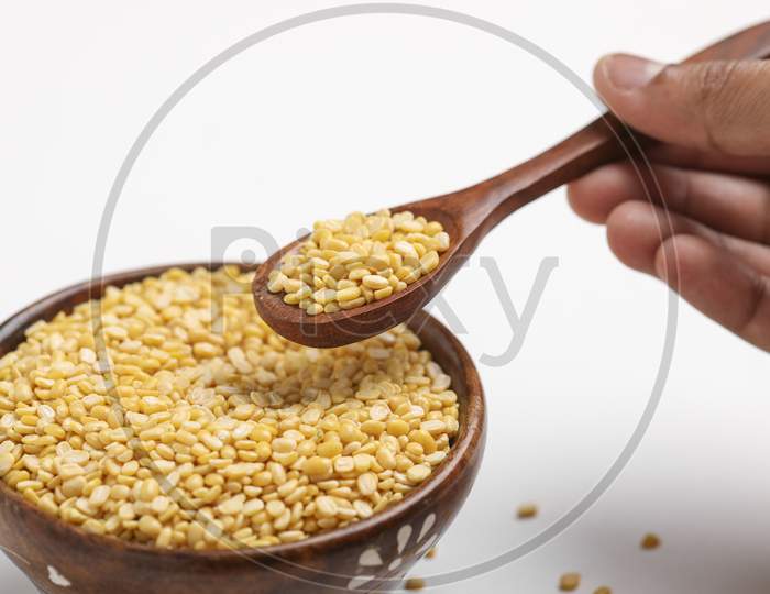 Yellow Moong Mung Dal Lentil Pulse Bean In Wooden And Spoon Bowl On White Background ,