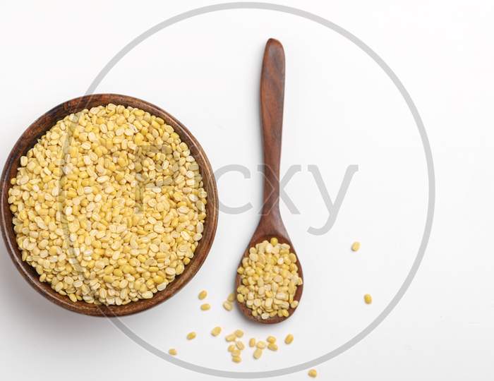 Yellow Moong Mung Dal Lentil Pulse Bean In Wooden Spoon On White Background ,