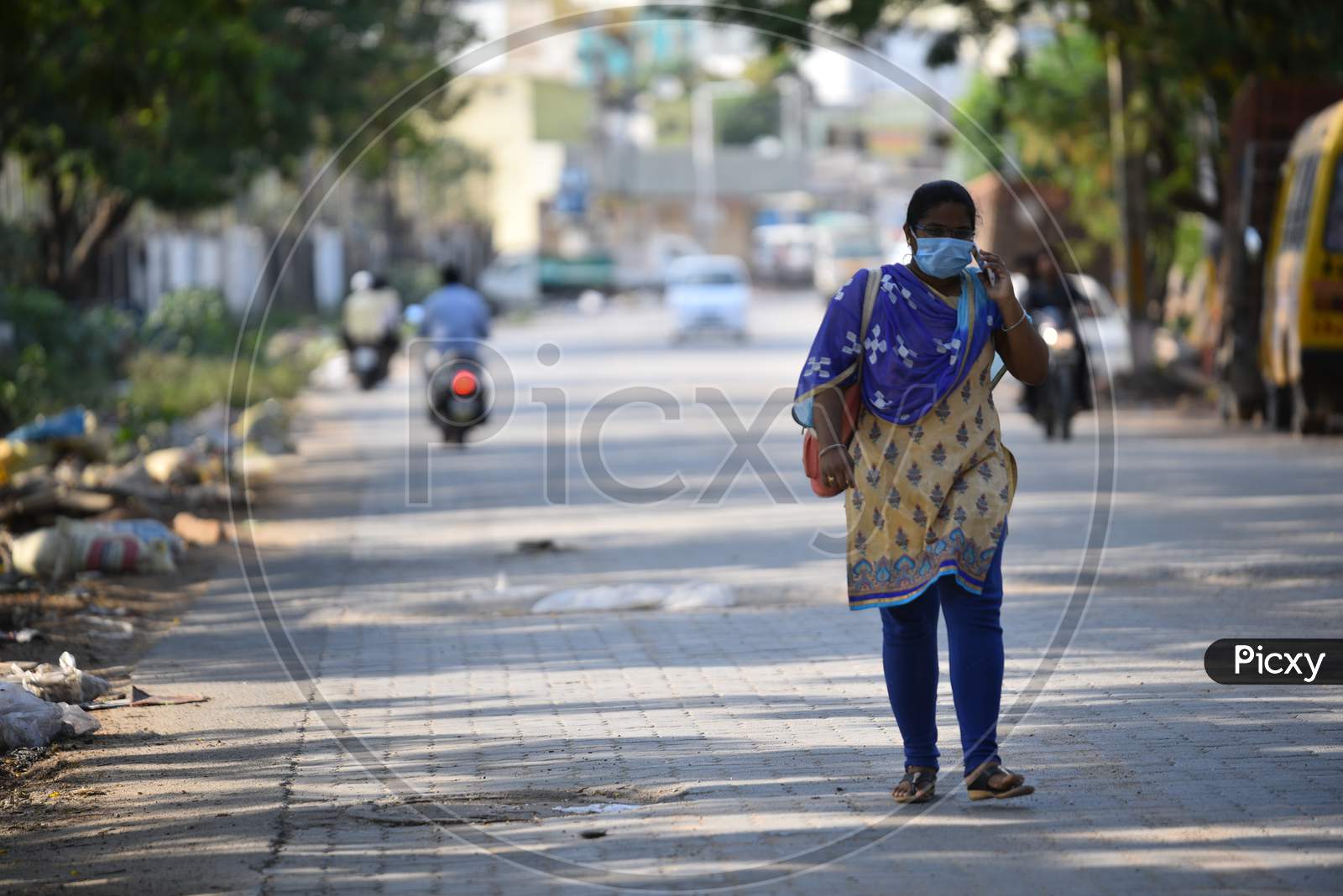 a woman wearing surgical mask during lockdown amid coronavirus pandemic