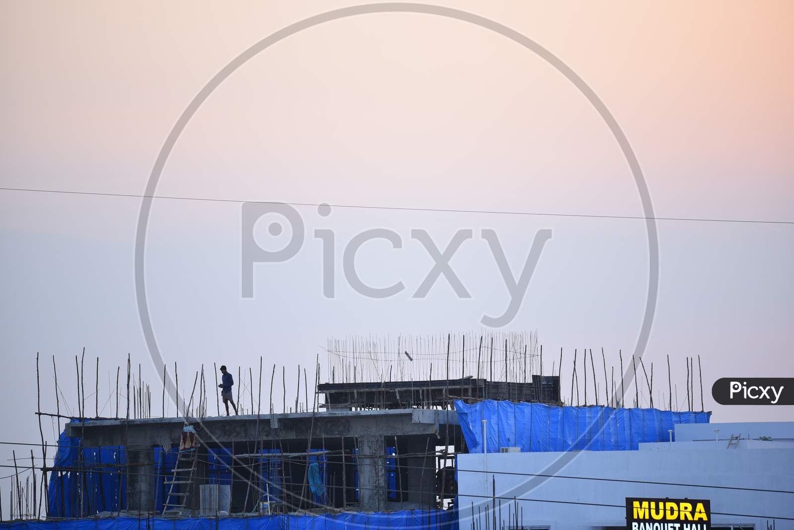 People sitting on their rooftops in the evenings to watch sunset to tackle the boredom due to the lockdown amid coronavirus outbreak