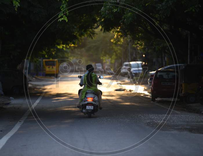 a two wheeler vehicle moving on an empty road during nstionwide lockdown amid coronavirus pandemic, April 2020