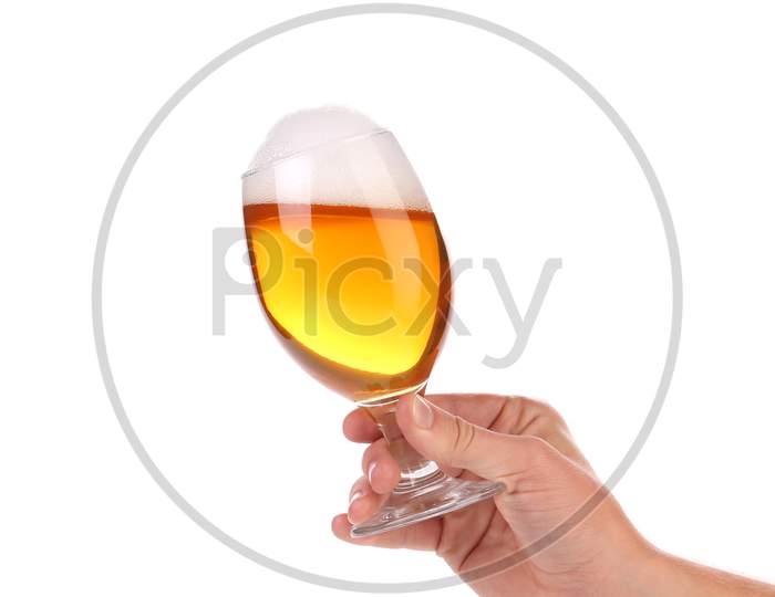 Glass Of Beer With Foam In Hand. Isolated On A White Background.