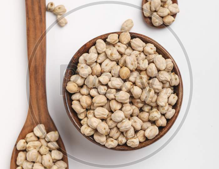 Uncooked Dried Chickpeas In Wooden Bowl And Spoon ,