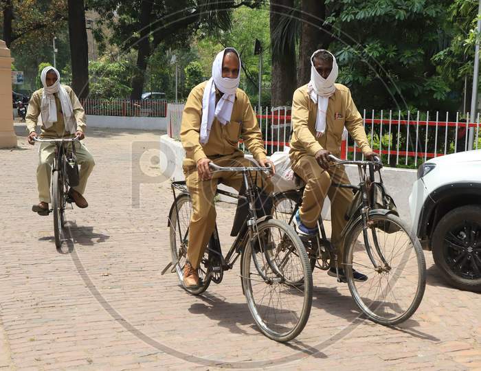 Postmen on their Way To deliver letters   During a Nationwide Lockdown Amidst COVID-19 or Coronavirus  Outbreak  In Prayagraj, April 20, 2020