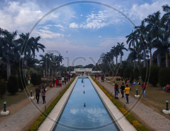 A Park With Fountain Having Beautiful Blue Sky Filled With People Of Pinjore Garden At Ambala-Shimla Highway, Pinjore, Chandigarh, Haryana