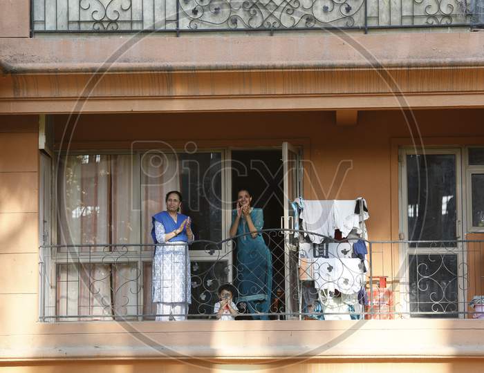 Indian people Clapping From Balconies For Doctors And Polices By the Call From PM Narendra Modi During Lockdown For Corona Virus Or COVID-19 Pandemic in Bangalore City