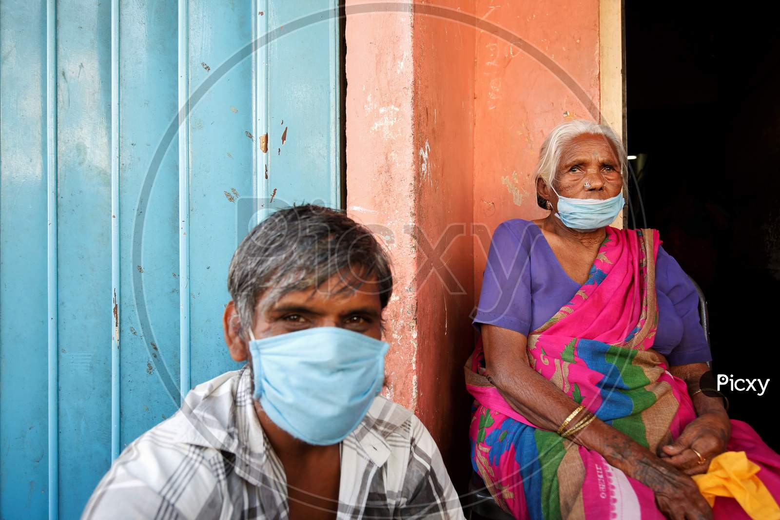An Elderly Couple Wearing Safety Masks  During Corona Virus Or COVID-19 Pandemic  In Bangalore City