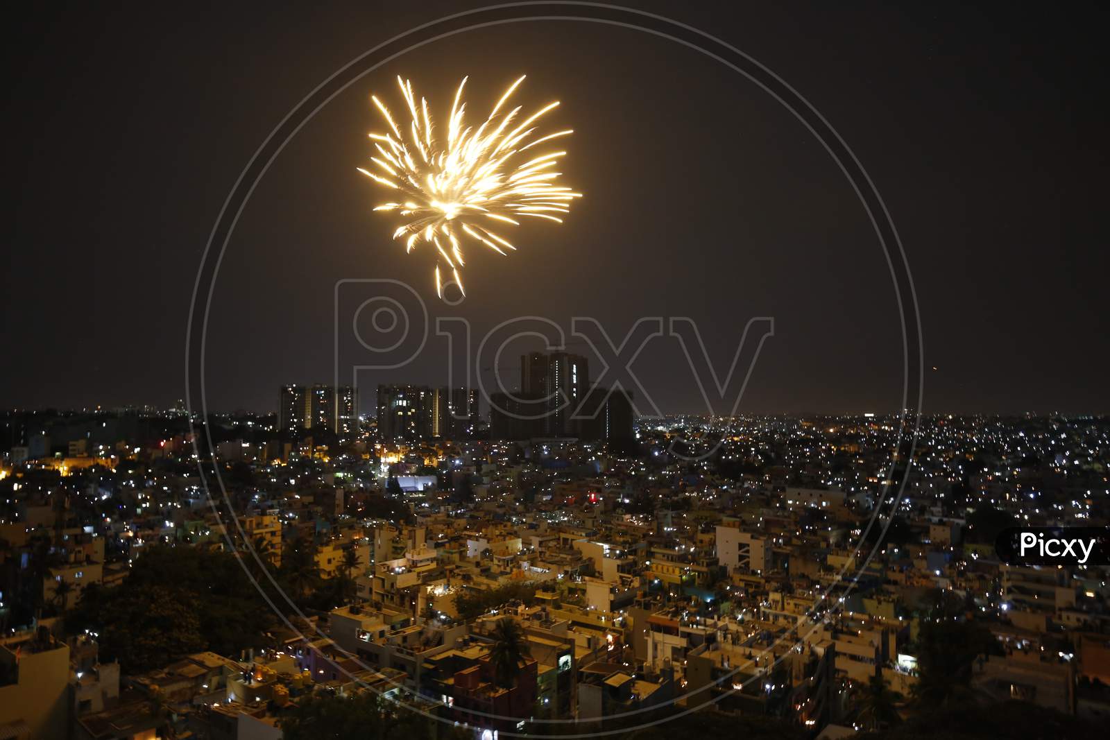 Fire Crackers Over Bangalore City Scape With Night City Lights