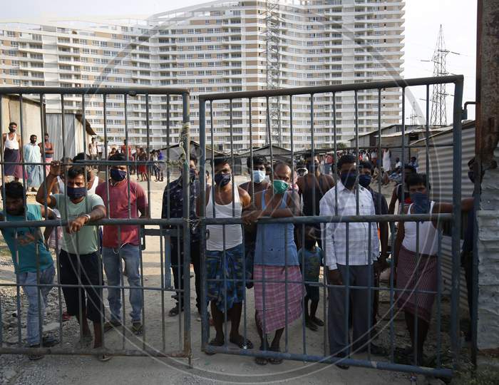 Crowd of Migratory Construction Workers Locked Down In a Construction Site due to Corona Virus or COVID-19 Pandemic In Bangalore City