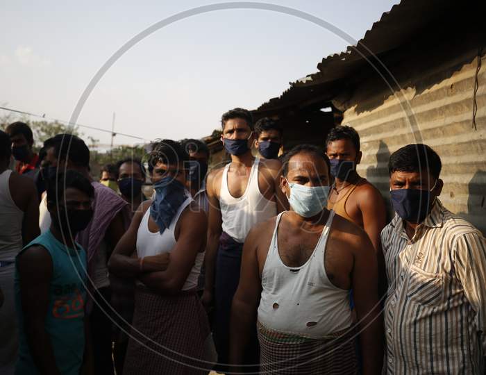 Crowd of Migratory Construction Workers Locked Down In a Construction Site due to Corona Virus or COVID-19 Pandemic In Bangalore City