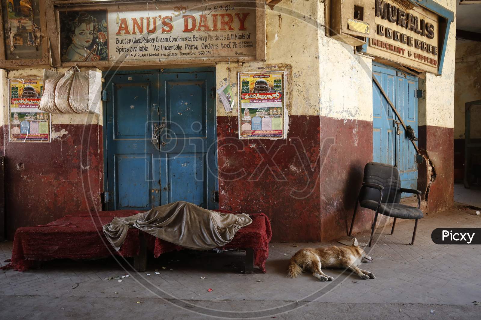A Dairy product vendor Sleeping At a Shop Door During Lockdown for Corona Virus Or COVID-19 Pandemic in Bangalore